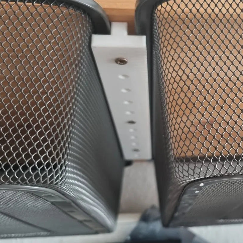 Two mesh car storage compartments with a white frame.