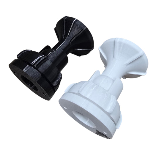 Black and white suction cup attachments on a white background